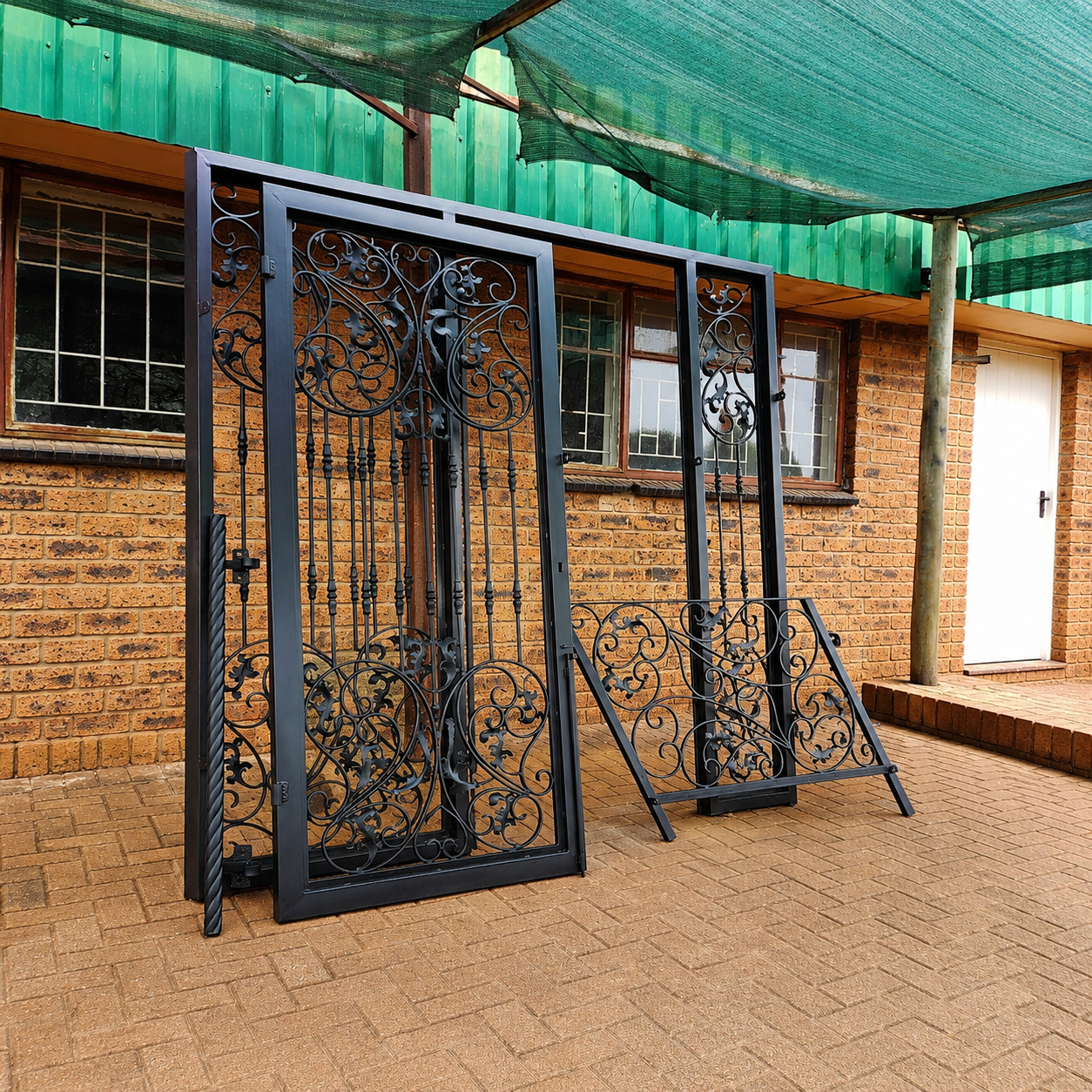 Ornate wrought iron security door set